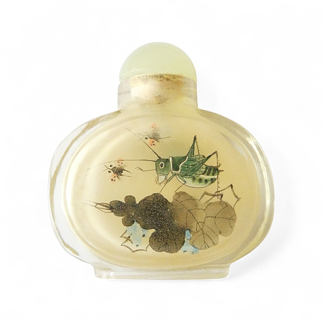 Inside-Painted Chinese Glass Snuff Bottle with Insects and Foliage, ca. 1970s: This charming inside-painted Chinese snuff bottle, dating to the mid-to-late 20th century (ca. 1970s), offers a delightful and uncommon subject rendered in delicate detail. Crafted in clear blown glas