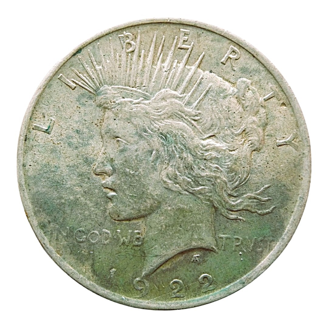 1922 United States Peace Dollar, Silver, Very Fine: This 1922 Peace Dollar represents one of the most iconic silver coins of the United States, issued in the aftermath of World War I to commemorate the restoration of peace. Struck in .900 fine silver, 