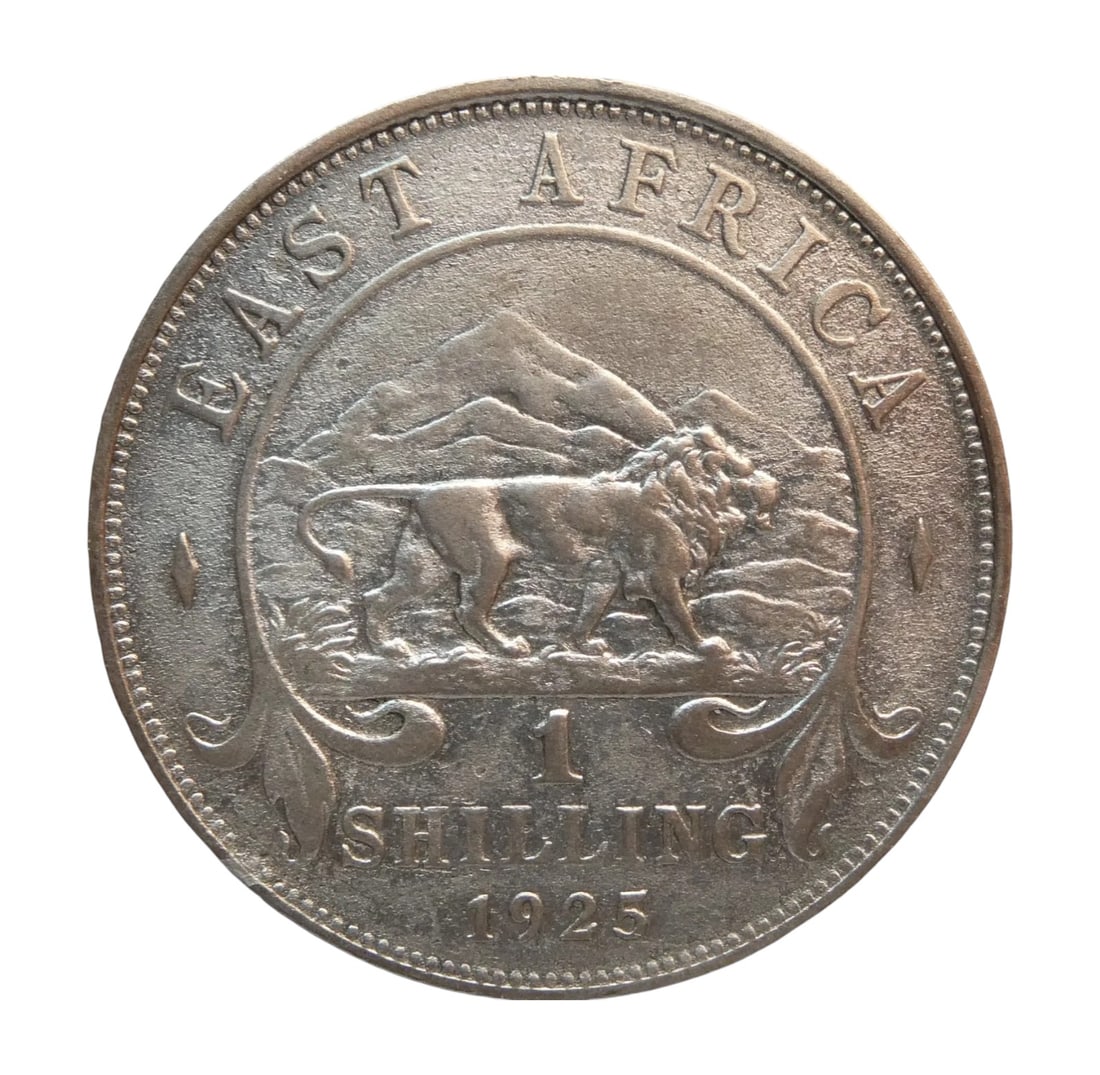 1925 East Africa 1 Shilling, George V, Lion & Mt. Kenya, Billon Silver: An appealing 1 Shilling coin from East Africa, minted in 1925 under the reign of King George V. This standard circulation issue, struck in billon alloy with 25% silver content, weighs 7.78 grams and m