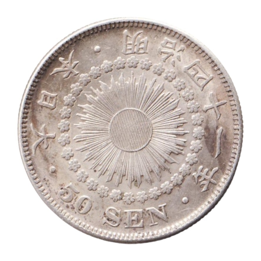 1906 - 1912 Japan Meiji Era 50 Sen Silver Coin, Chrysanthemum Crest: A finely struck silver 50 Sen coin issued under Emperor Meiji, dated to the later Meiji years 39?45 (1906?1912). Minted in 0.800 fine silver, this round milled coin weighs 10.13 grams and measures 27.