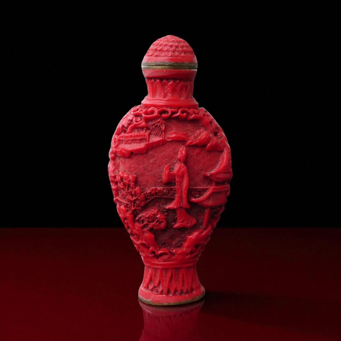 Carved Chinese Cinnabar Lacquer Snuff Bottle with Signature, ca. 20th Century: This finely carved Chinese cinnabar lacquer snuff bottle, produced in the 20th century, exemplifies the craftsmanship and symbolic artistry associated with carved lacquerware. The bottle, measuring ap