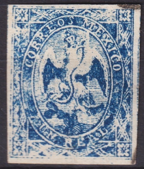 1864 Mexico Coat of Arms 1 Real Ultramarine, Scott #22b: This scarce 1864 Mexico Coat of Arms issue, valued at 1 Real, presents the iconic crowned eagle devouring a serpent, a national symbol deeply rooted in Aztec legend and adopted as the official emblem 