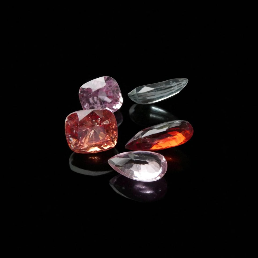 Fine Group of 5 Burma Spinels, 4.35 ct Total, Mixed Cuts: This exquisite ensemble comprises five natural spinels from Burma (Myanmar), collectively weighing 4.35 carats, cut in a variety of elegant styles including pear and cushion shapes. Dating to the mid-