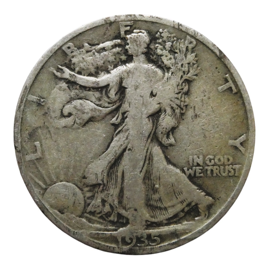 1935 Walking Liberty Half Dollar, Philadelphia Mint, Silver Issue: Struck in 1935 at the Philadelphia Mint, this 50-cent coin features the iconic Walking Liberty design by Adolph A. Weinman, considered one of the most artistically acclaimed motifs in U.S. numismatics