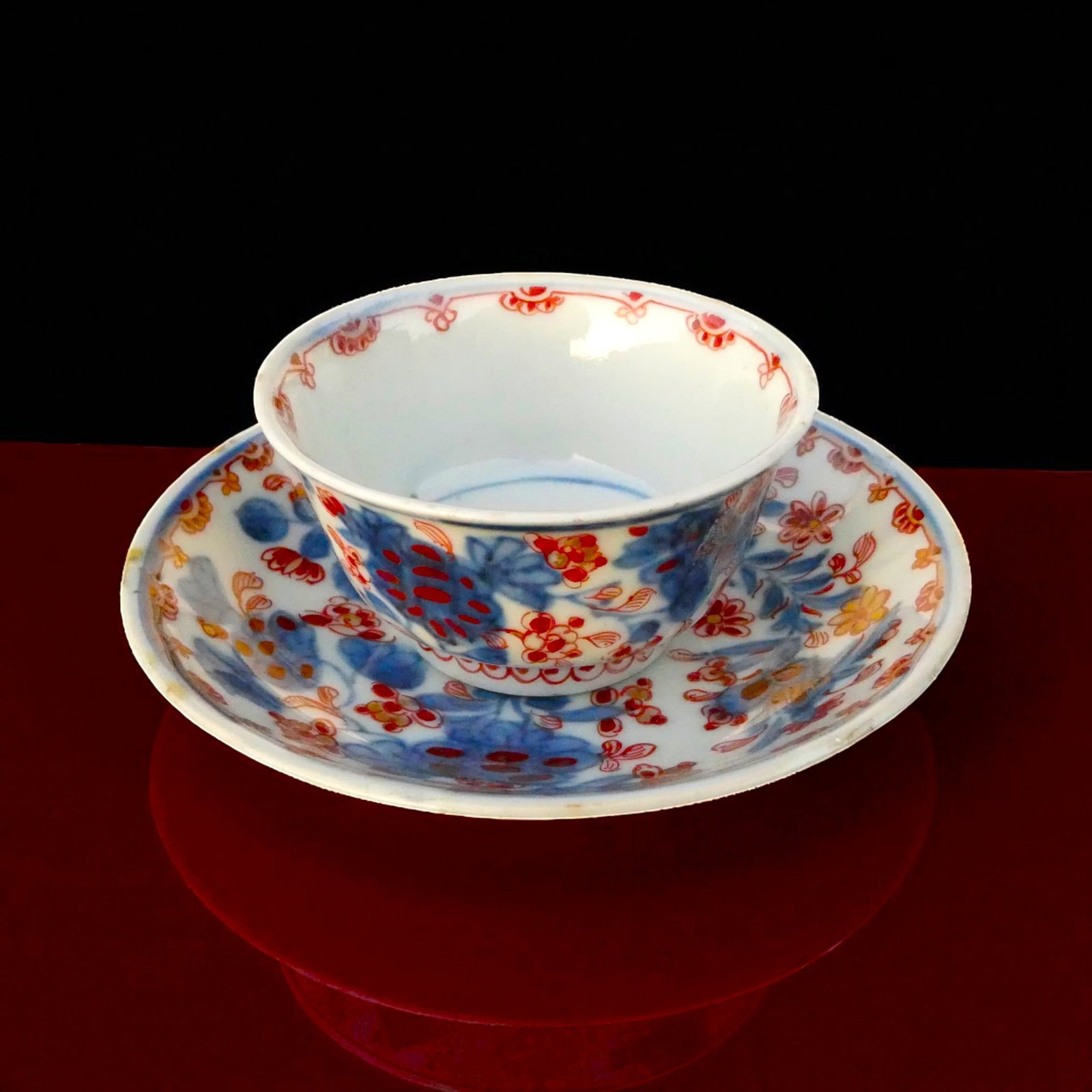 Fine Chinese Imari Porcelain Cup and Saucer, 18th Century: A finely potted Chinese porcelain cup with matching saucer, dating to the 18th century, executed in the highly desirable Imari palette of underglaze blue with overglaze iron-red and gilt floral motifs