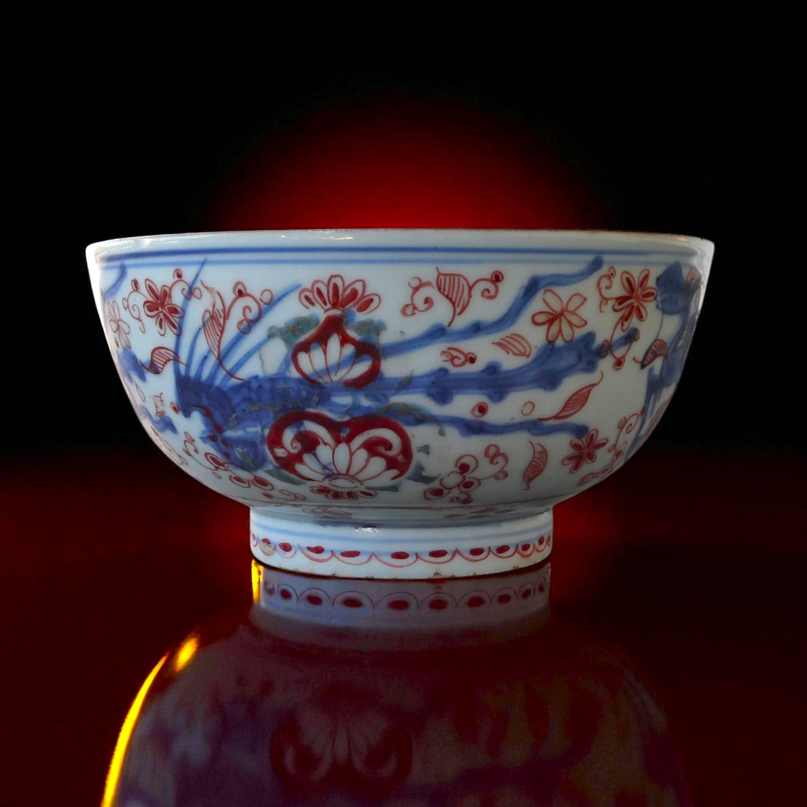 Qing/Republic Period Chinese Imari Style Porcelain Bowl, Late 19th – Early 20th Century: A decorative porcelain bowl in the Imari palette, dating from the late Qing dynasty to early Republic period (late 19th to early 20th century). The exterior is richly ornamented with stylized floral s