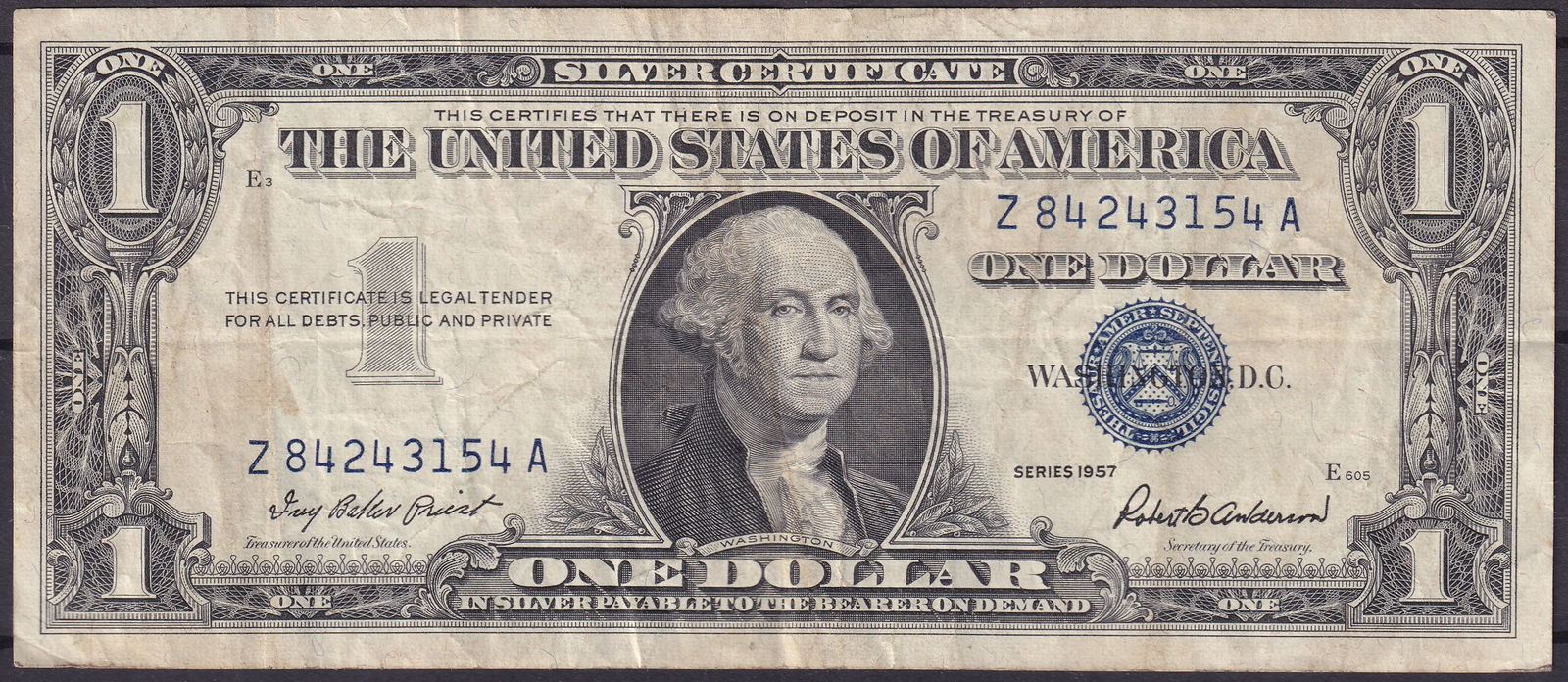 1957 USA $1 Silver Certificate Z84243154A – Blue Seal: This 1957 $1 Silver Certificate of the United States, bearing the serial number Z84243154A, represents one of the final issues of silver-backed notes before the Treasury ceased their redemption in the