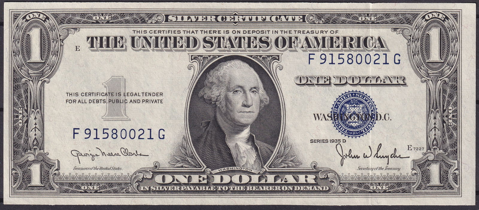 USA 1935D $1 Silver Certificate – Serial F91580021G: This United States $1 Silver Certificate, Series 1935D, bears the serial number F91580021G and features the portrait of George Washington at the center, with the blue Treasury seal and serial numbers