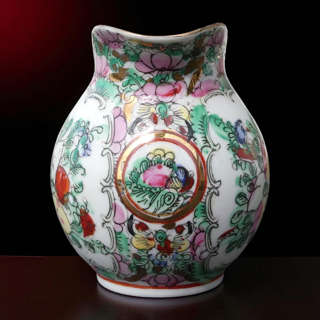 Macau Rose Medallion Export Creamer with Butterfly and Peony Motifs, c.1950: This finely crafted porcelain creamer was produced in Macau circa 1950, during a flourishing period of decorative ceramic export aimed at Western markets. Executed in the distinctive Rose Medallion st