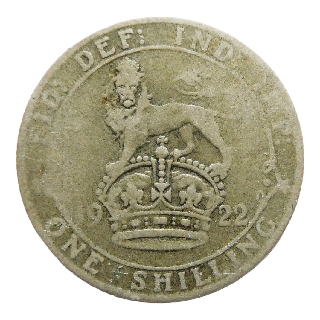 1922 One Shilling, King George V, .925 silver, United Kingdom: This 1922 British shilling was struck in sterling silver (.925) during the reign of King George V, prior to the silver debasement of 1920s coinage reform. The obverse bears the portrait of King George