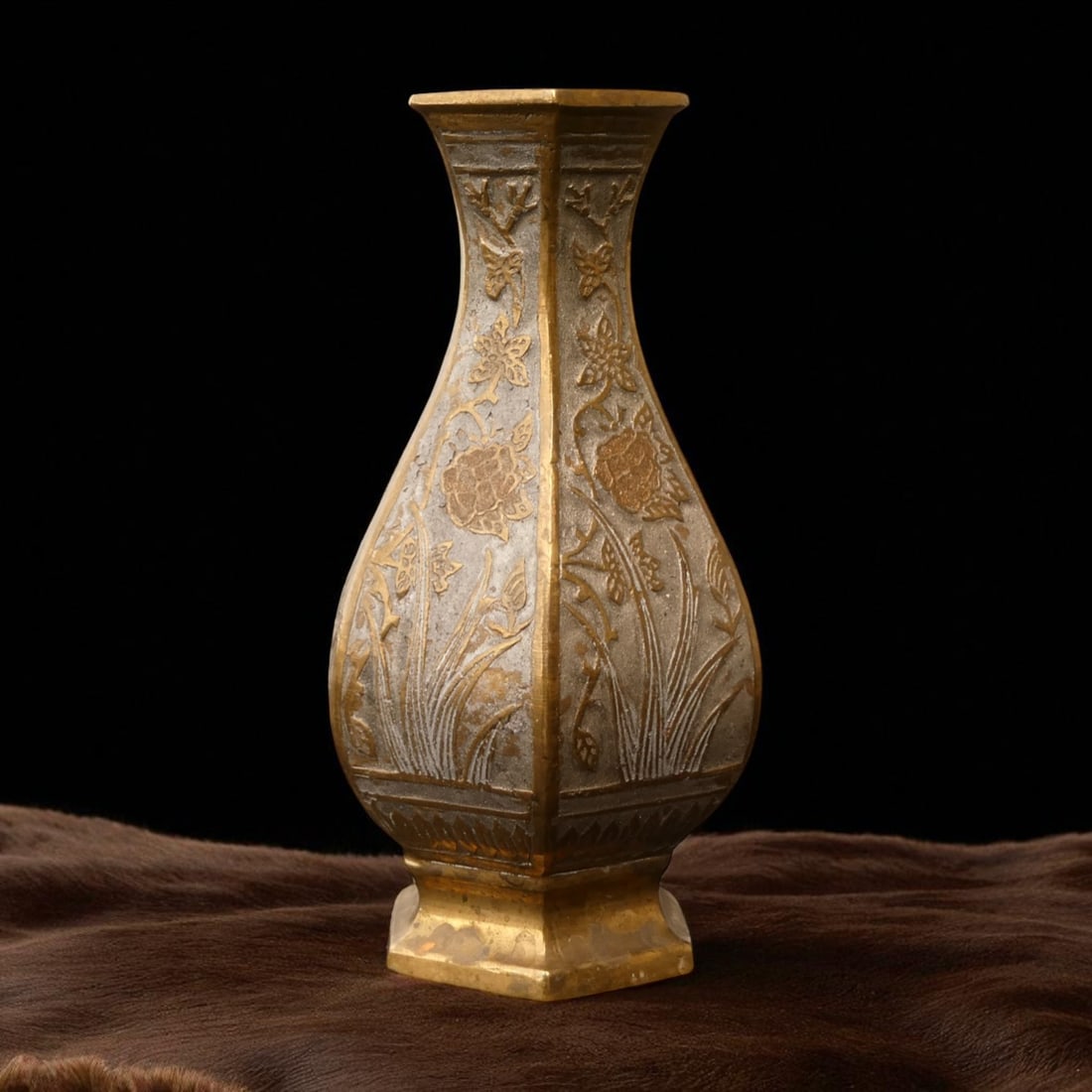 Gilt Bronze Hexagonal Vase with Peony Relief, Late Qing Dynasty: This elegant hexagonal bronze vase, weighing 383 grams and standing 13.5 cm high with a maximum width of 7.5 cm, exemplifies the refined aesthetic of late Qing dynasty Chinese metalwork, likely dating