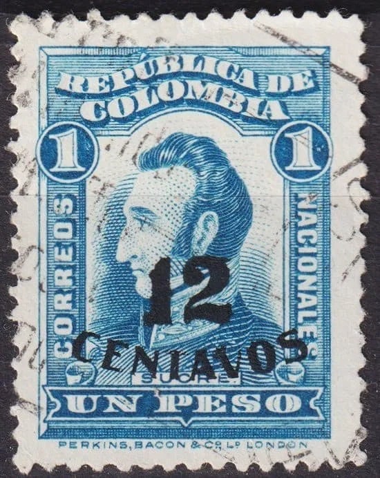 Rare Colombia 1935 12c on 1 Peso Sucre Blue Overprint Scott CO440: This rare and historically significant stamp originates from Colombia’s 1935 issue, belonging to the "Patriotic Symbol Types of 1917" series, revalued during a period of postal and fiscal adjustment