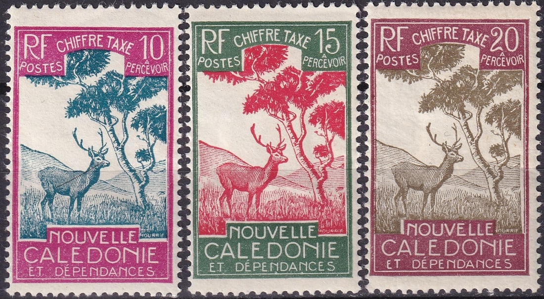 New Caledonia 1928 Postage Due Stamps – Deer and Tree Designs (Scott J22–J24): A fine trio of postage due stamps from New Caledonia, issued in 1928 and designed by Georges Hourriez, depicting a stylized deer beneath a native tree, a subject that reflects the unique fauna and lan