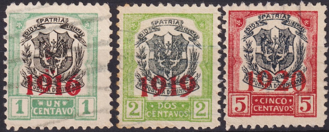 Dominican Republic 1916–1920 Overprinted Coat of Arms Issues Scott 210, 219, 223: This scarce trio of early Dominican Republic Coat of Arms issues features the patriotic motto “Dios, Patria, Libertad” above the national shield, overprinted in bold red with the respective ye