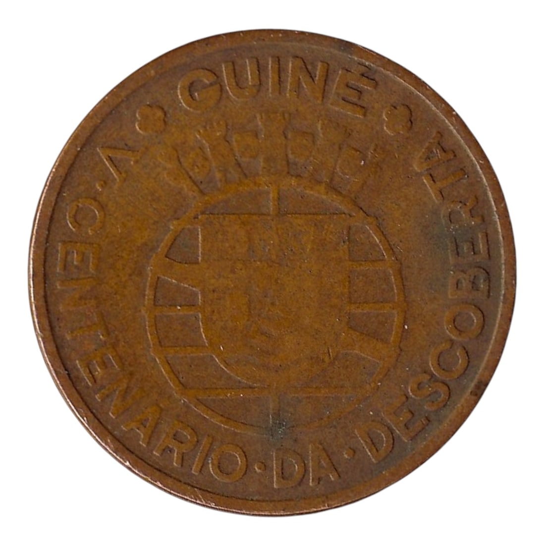 1946 Portuguese Guinea 1 Escudo Bronze Centenary Coin KM#7: Issued in 1946 to commemorate the 500th anniversary of the discovery of Guinea, this Portuguese Guinea 1 Escudo coin (KM#7) was struck at the Lisbon Mint in bronze. The obverse bears the national arms