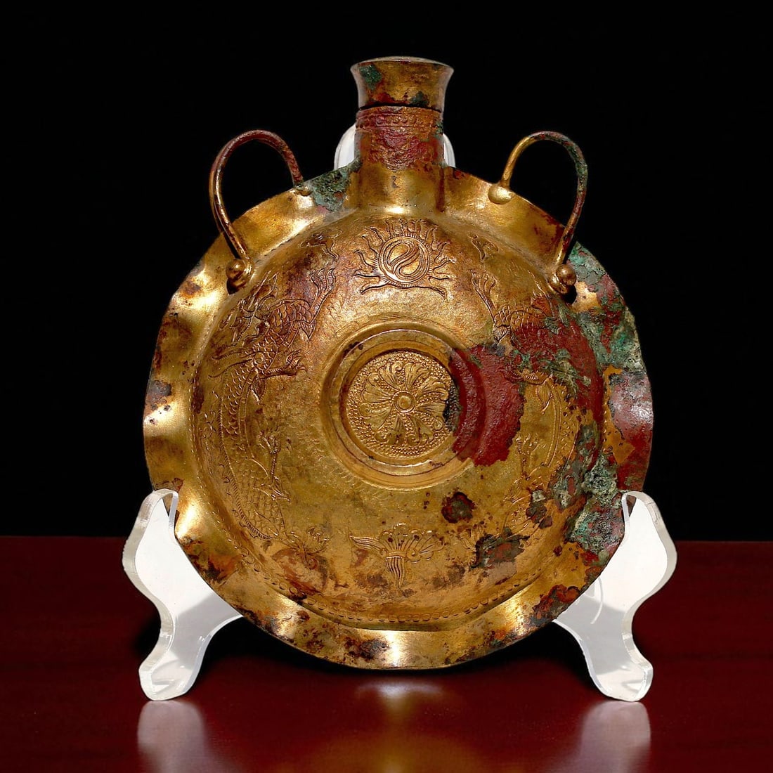 Rare Gilt Bronze Ceremonial Flask, Liao–Jin Dynasty, 10th–13th Century: This rare and richly adorned gilded bronze ritual flask dates to the Liao (907–1125) or Jin (1115–1234) Dynasty, a period marked by strong Central Asian artistic influence and dynamic metalworking