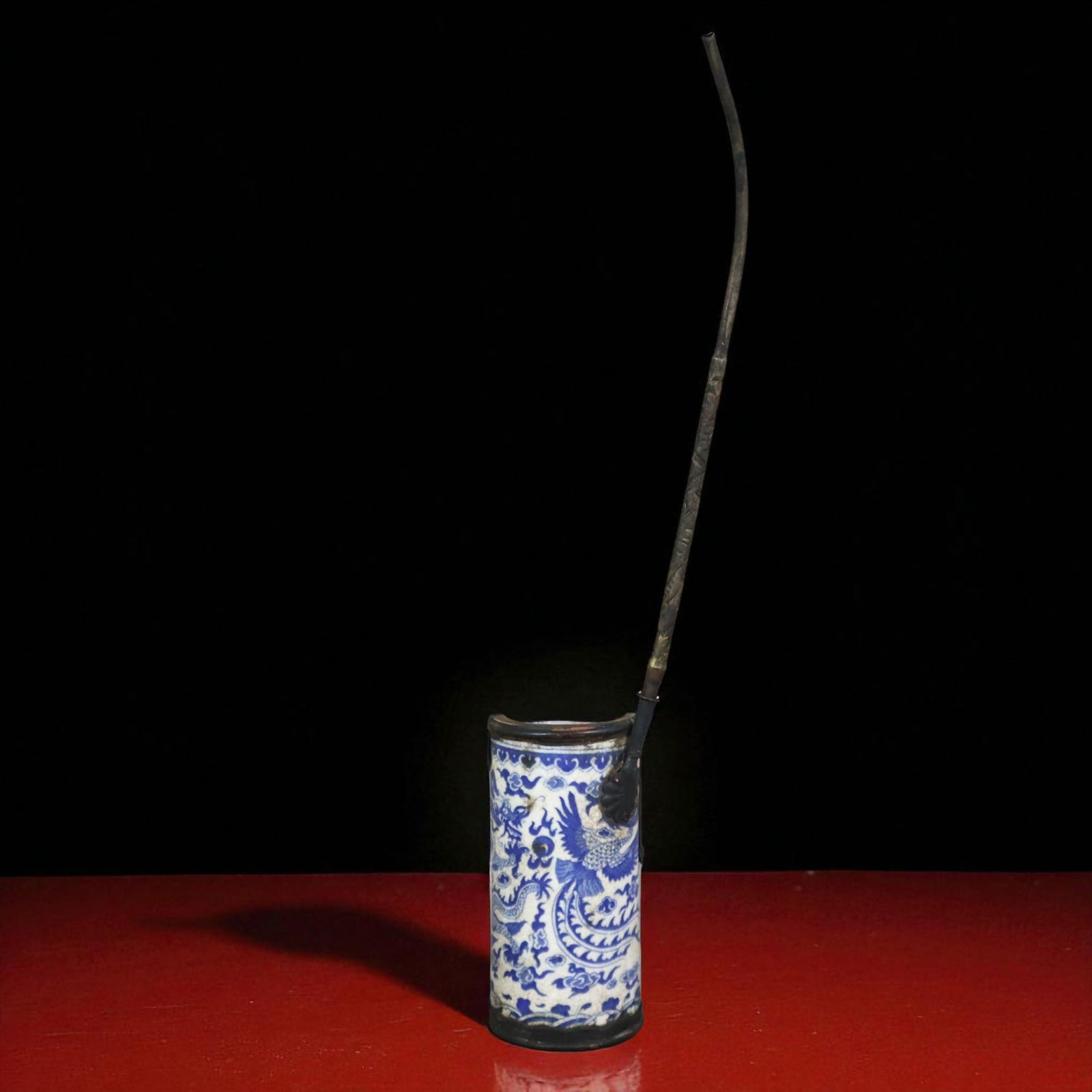 Chinese Blue and White Porcelain Opium Pipe with Dragon and Phoenix, c. 1900–1930, Xuande Mark: This early 20th century Chinese blue and white porcelain opium pipe is a finely crafted example of late Qing to early Republic period workmanship dating to around 1900 to 1930 and decorated in undergl