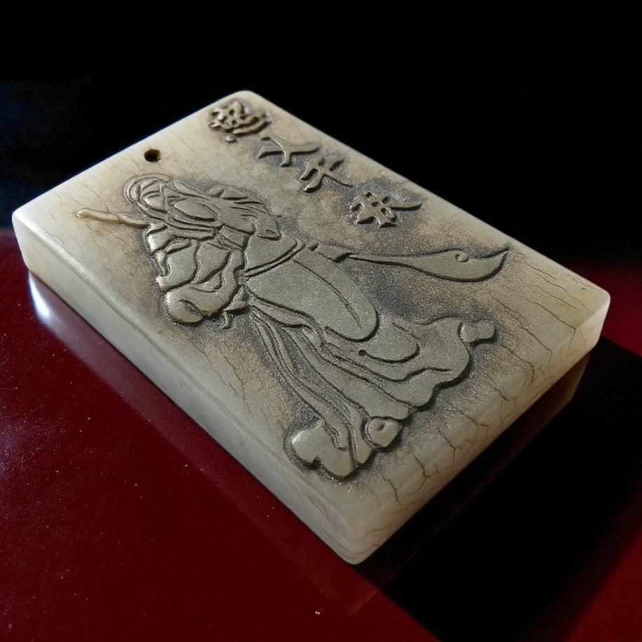 Qing Dynasty Hand-Carved Hetian Jade Warrior Pendant, ca. 18th-19th Century: This finely carved rectangular Hetian jade plaque from the Qing Dynasty (1644?1912) features the detailed depiction of a male warrior figure, most likely representing the legendary general Guan Yu, a