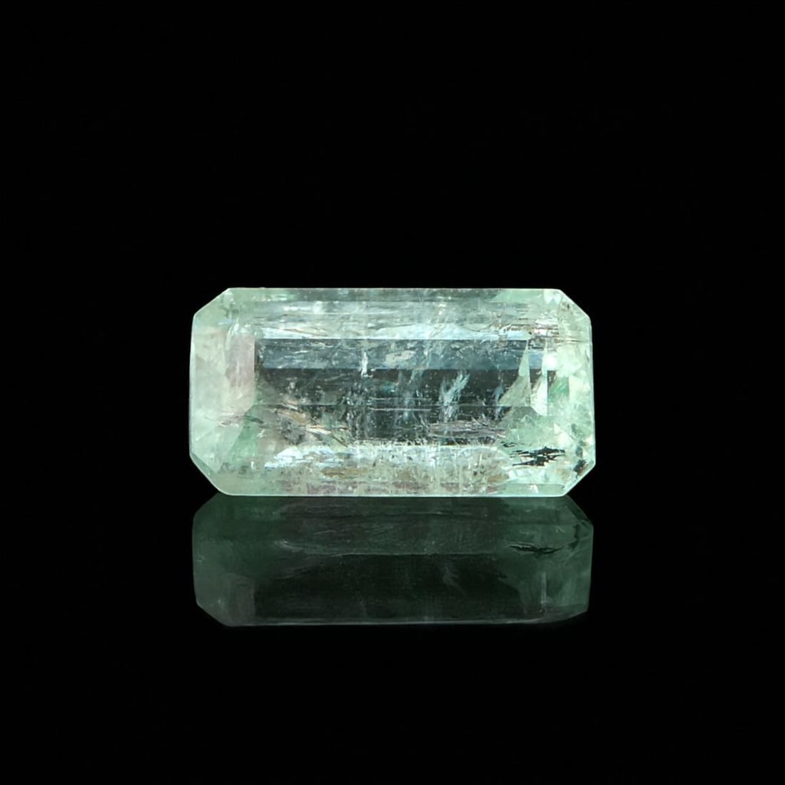 Afghan Emerald, 1.32 Carat, Panjshir District, IGI Certified: A natural emerald of fine origin from the renowned Panjshir Valley, Afghanistan, weighing 1.32 carats and cut in the classic emerald style. This stone, measuring 8.80 x 4.59 x 4.10 mm, displays a deli