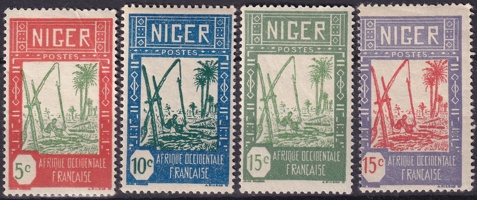 Niger 1926–1928 Definitives Drawing Water from Well Michel FR-NE 32–35: This complete definitive group from Niger, issued between 1926 and 1928 under French West Africa, represents the celebrated “Drawing Water from Well” design, an iconic colonial motif illustrat