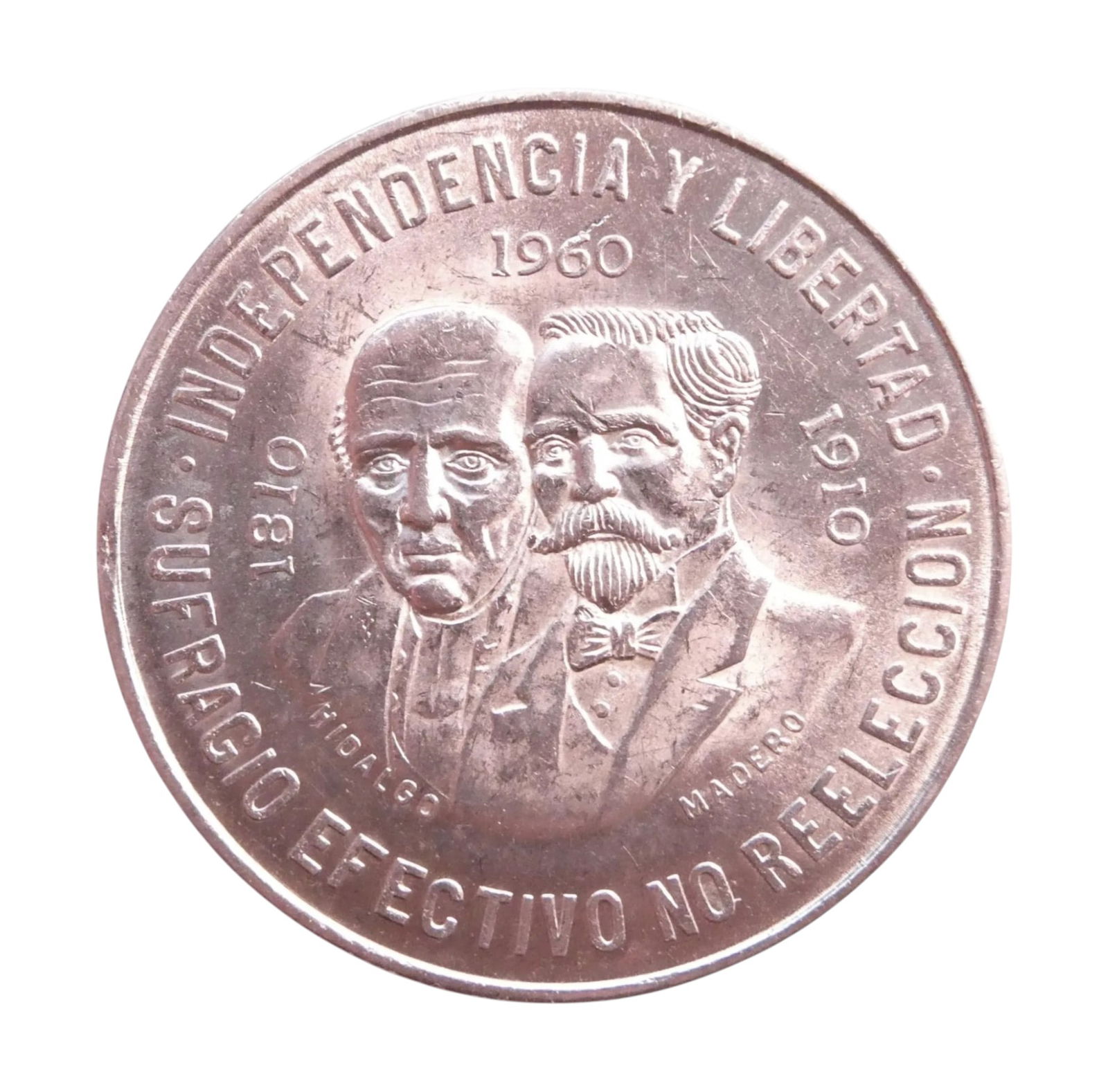 1960 Mexico 10 Pesos Silver Centennial of Independence: This Mexican 10 Pesos silver coin was issued in 1960 to commemorate the centennial of the country's War of Independence (1810) and the 50th anniversary of the Mexican Revolution (1910). The obverse fe