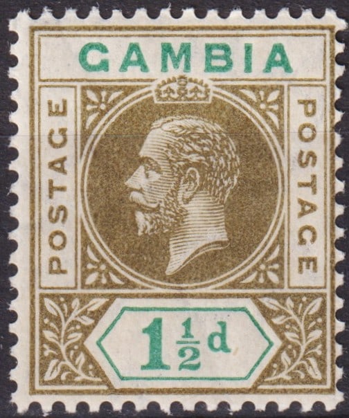 British Gambia 1921 King George V 1½d Brown and Blue-Green, Mint, SG 110: This elegant postage stamp from Gambia, issued in 1921 during the reign of King George V, belongs to the definitive series produced by De La Rue & Co. Ltd. The design features the finely engraved left