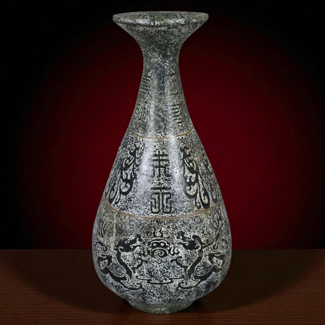 Chinese Limestone Archaistic Vase with Dragon Reliefs and Imperial-Style Seal, c. 1950–1970: This substantial Chinese vase, dating to circa 1950–1970, is crafted from mottled green and grey limestone, partially polished to accentuate its finely carved decoration. Inspired by ritual bronzes