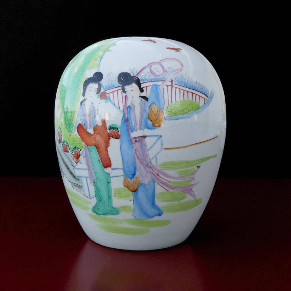 Republic Period Chinese Famille Rose Ovoid Vase with Courtyard Scene, c. 1920s: This elegant Chinese porcelain vase, dating to the Republic Period circa 1920s, exemplifies the refined artistry and narrative style typical of early 20th-century Famille Rose ware. Finely potted in a