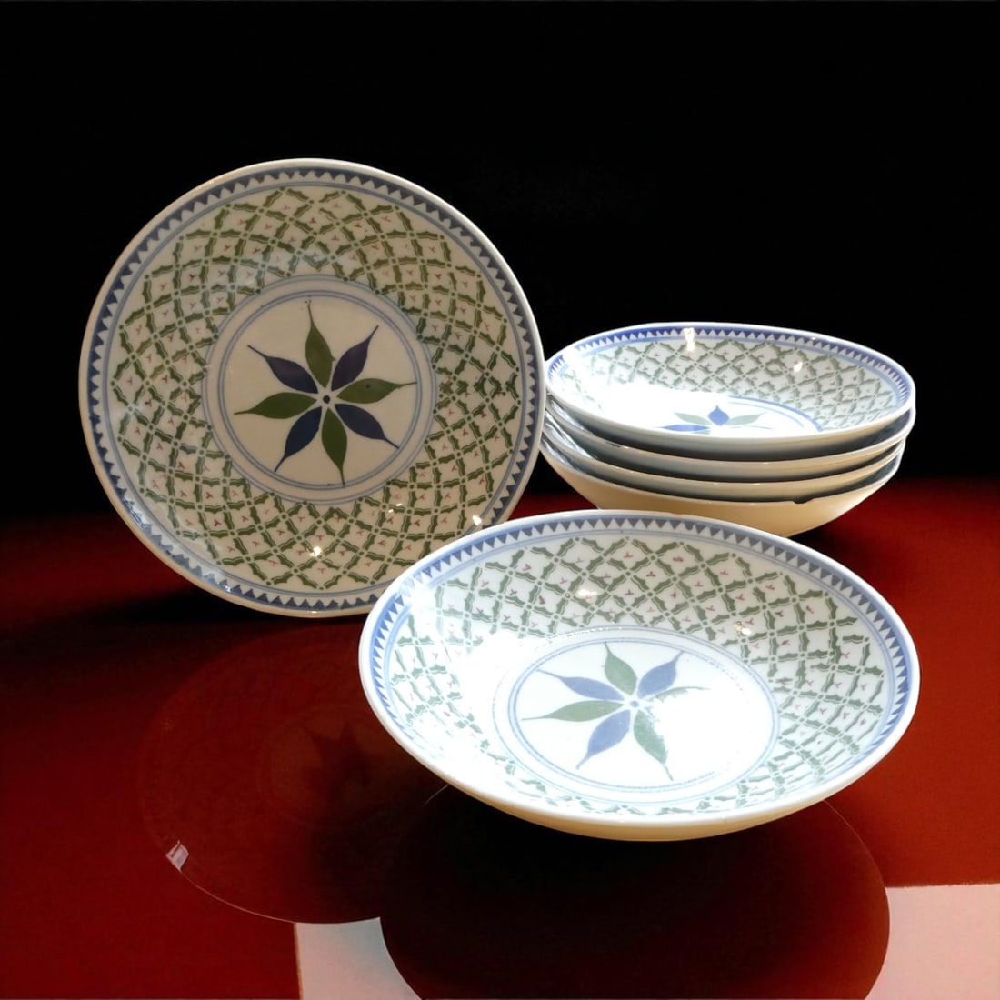 Set of Six Polychrome Porcelain Dishes with Floral Trellis Pattern: This elegant set of six porcelain dishes, each measuring approximately 16.5 cm in diameter and 3.5 cm in height, presents a harmonious balance of decorative sophistication and functional design, typic
