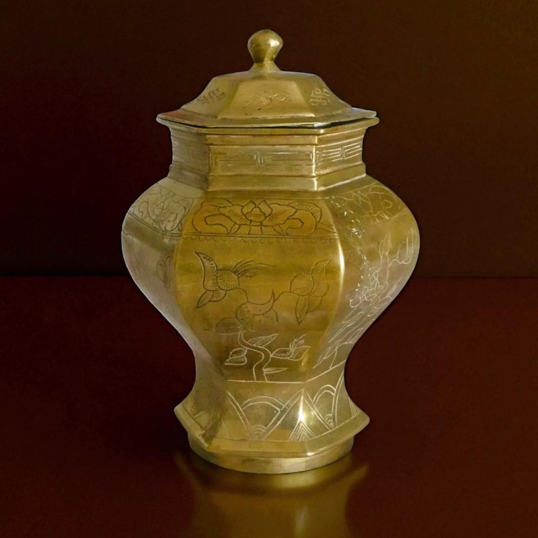 Hexagonal Chinese Engraved Brass Jar with Lid and Dragon Base, c.1900: A finely cast and engraved Chinese hexagonal brass jar with original lid, dating to the late Qing Dynasty or early Republican era, circa 1900. Standing 16.5 cm tall and weighing 840 grams, the vessel