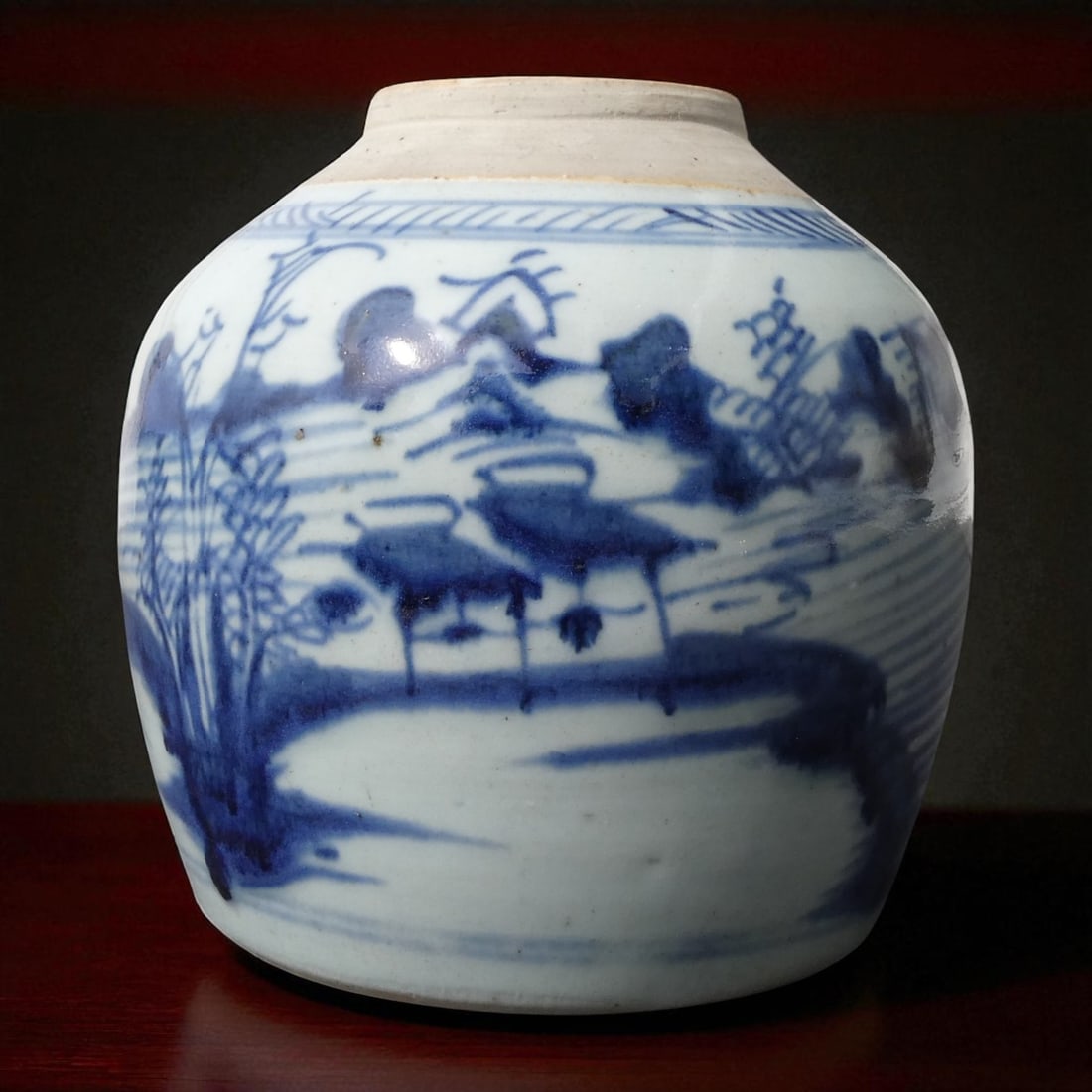 Qing Dynasty Style Blue and White Chinese Jar with Landscape Motif, 19th Century: This substantial hand-thrown porcelain jar originates from China and dates to the late Qing Dynasty period, circa 19th century. Measuring 17 cm in height and 16 cm in width, and weighing 934 grams, th
