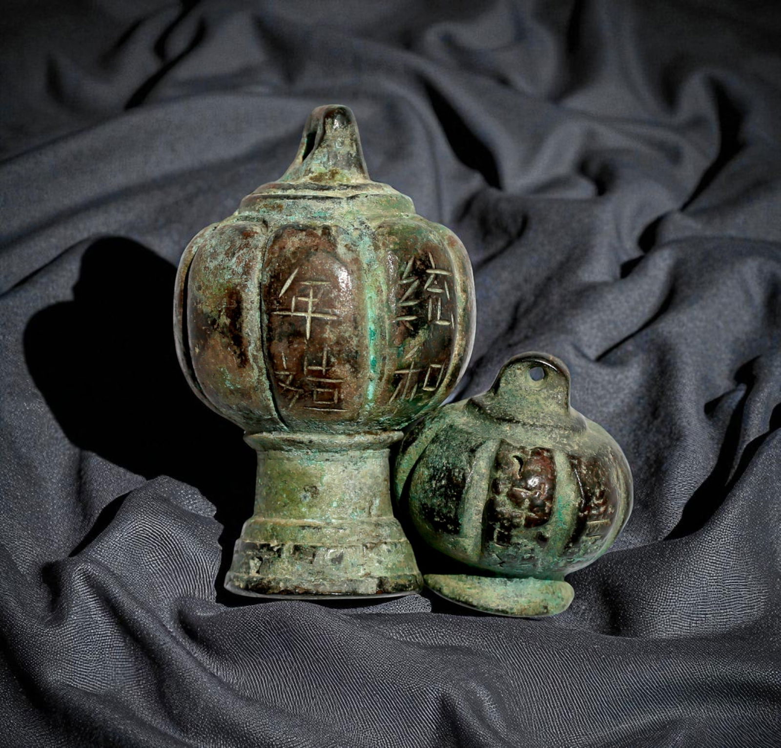 Pair of Official Bronze Weights, Liao Dynasty Tonghe Period (983–1012): This rare pair of cast bronze official weights dates to the Tonghe reign period (983–1012) of the Liao Dynasty, a powerful Khitan-led empire in northern China. The larger weight measures approximate