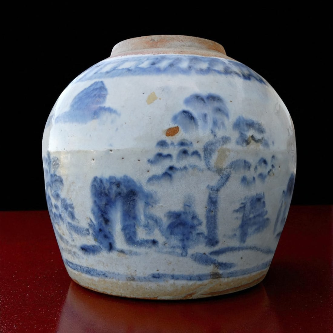 Late Ming Dynasty Blue and White Jar with Landscape Motif, c. 1600–1650: This robust globular jar, measuring approximately 17 cm in height and 15 cm in diameter and weighing 673 grams, is a quintessential example of utilitarian yet artfully decorated stoneware from the lat