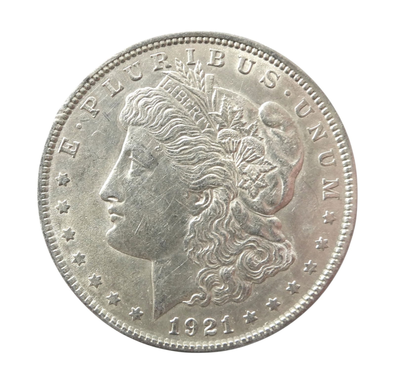 1921 US Morgan Silver Dollar, 90% Silver, Philadelphia Mint: This is an original 1921 Morgan Silver Dollar, one of the most iconic and widely collected coins in American numismatics. The 1921 issue marks the final year of the original Morgan Dollar series befor