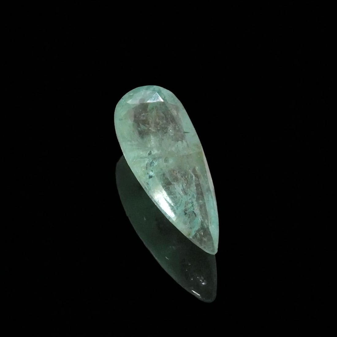 2.34 ct Pear-Cut Emerald, IGI Certified, Light Green: This delicately colored pear-shaped emerald weighing 2.34 carats presents a refined, elongated silhouette ideal for elegant pendant designs and statement rings. Certified by the International Gemologi