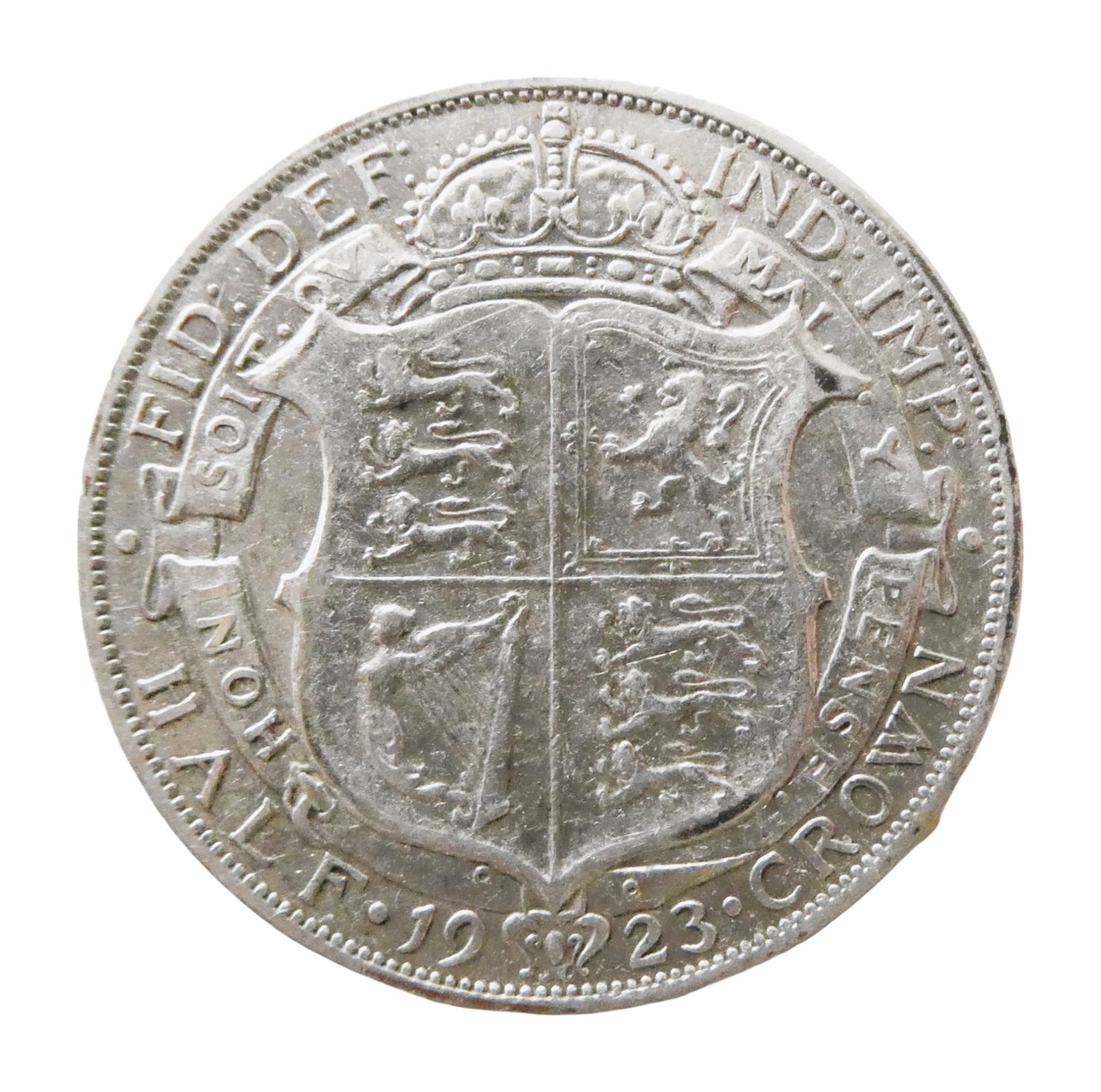United Kingdom Half Crown, George V, 1923 Silver Coin: This British half-crown coin from 1923 was issued during the reign of King George V and represents a classic example of British numismatic design from the early 20th century. The obverse features the 