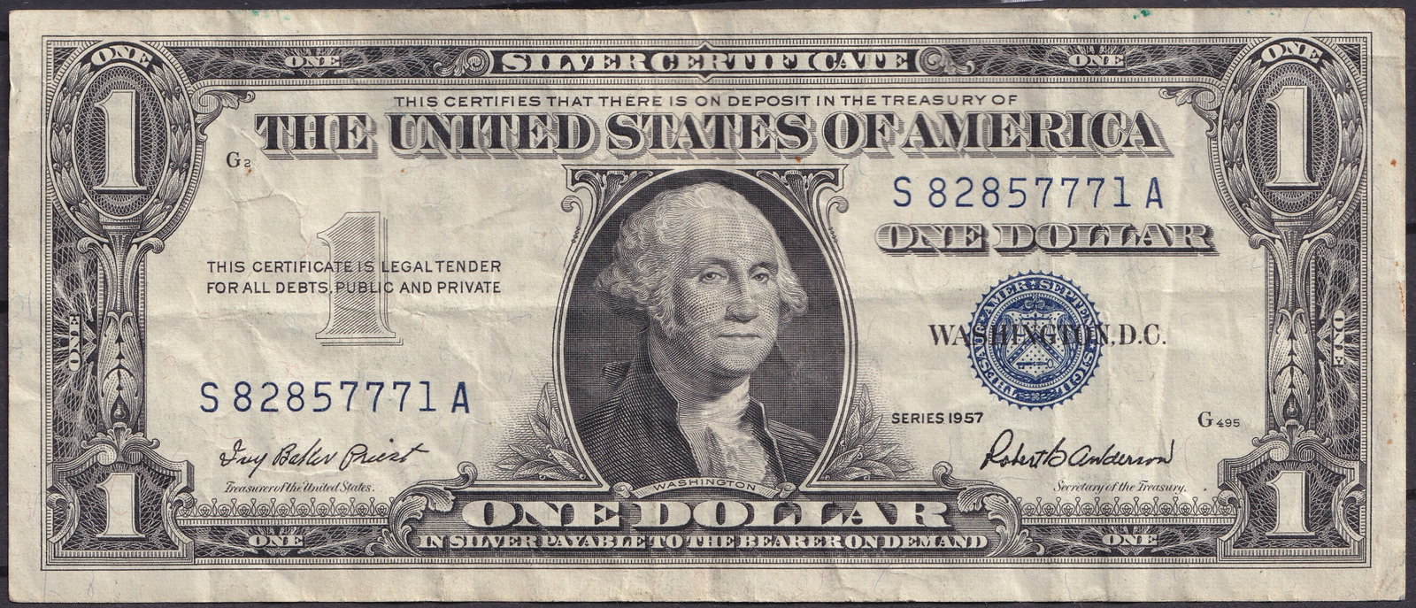 1957 United States Silver Certificate One Dollar S82857771A: This original One Dollar Silver Certificate was issued in 1957 by the United States of America and represents the final regular issue of silver backed paper currency intended for everyday circulation.