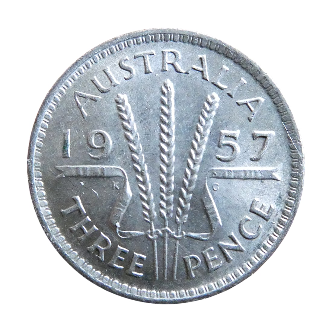 Australia 1957 Silver Threepence, Elizabeth II, Wheat Sheaves: Issued in 1957 under Queen Elizabeth II, this Australian threepence belongs to the pre-decimal coinage system based on the British pound. Struck in silver with a weight of 1.41 grams and a diameter of