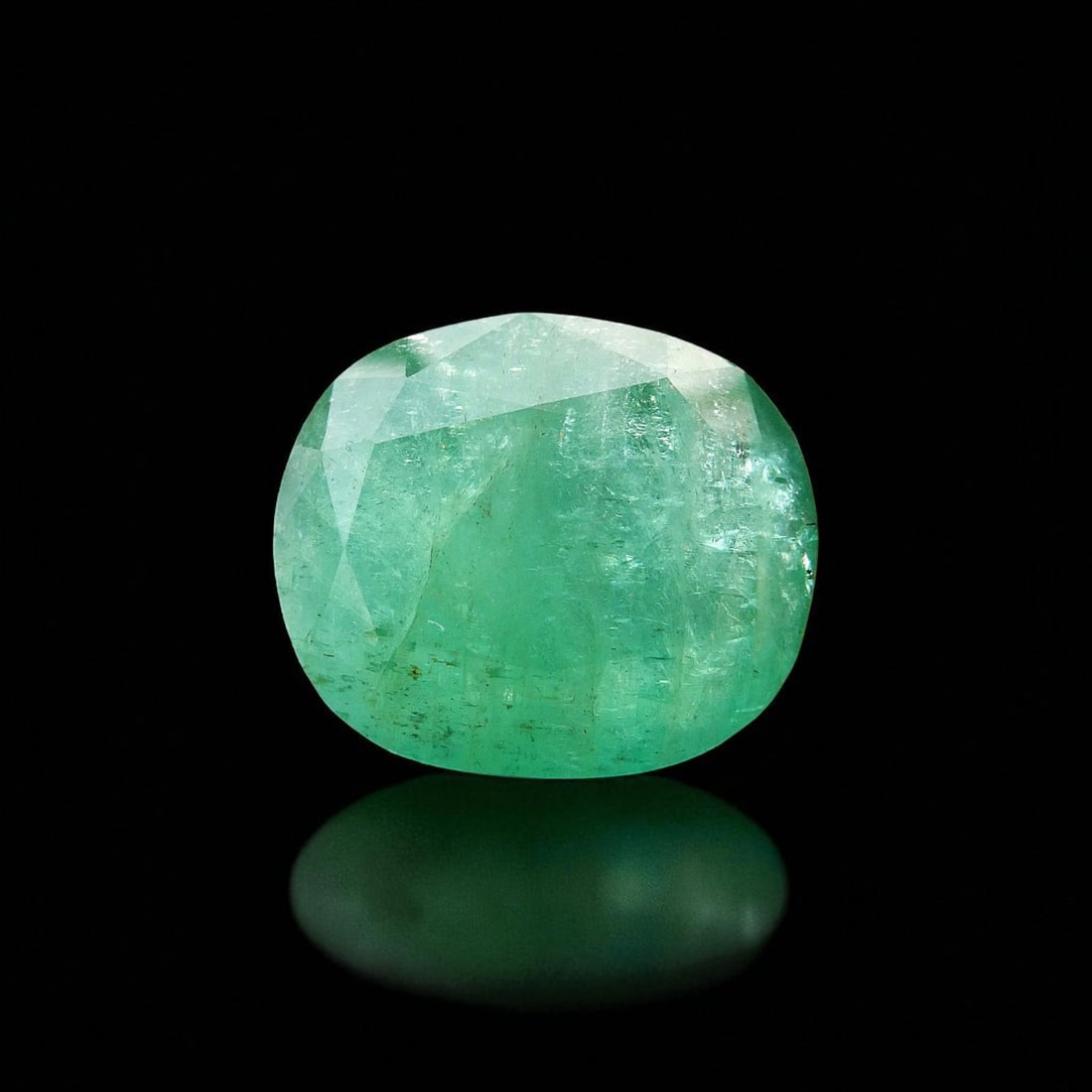 IGI certified 42.98ct Cushion-Cut Natural Emerald from Swat, Pakistan: This monumental 42.98-carat natural emerald, certified by the International Gemological Institute (IGI Report No. 583326781, dated June 14, 2023), is a rare example of large-format gem material from t