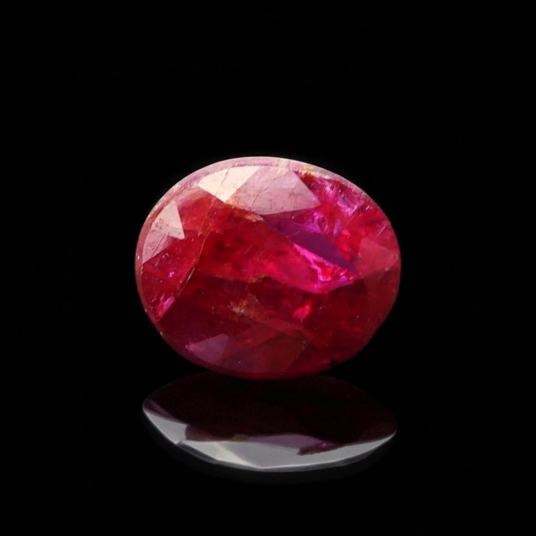 1.64 ct Treated Natural Ruby, Deep Orangy Red, ALGT Certified: This certified natural corundum, identified as a treated ruby, exemplifies the enduring allure of classic gemstone aesthetics combined with modern gemological analysis. Originating from an unspecified