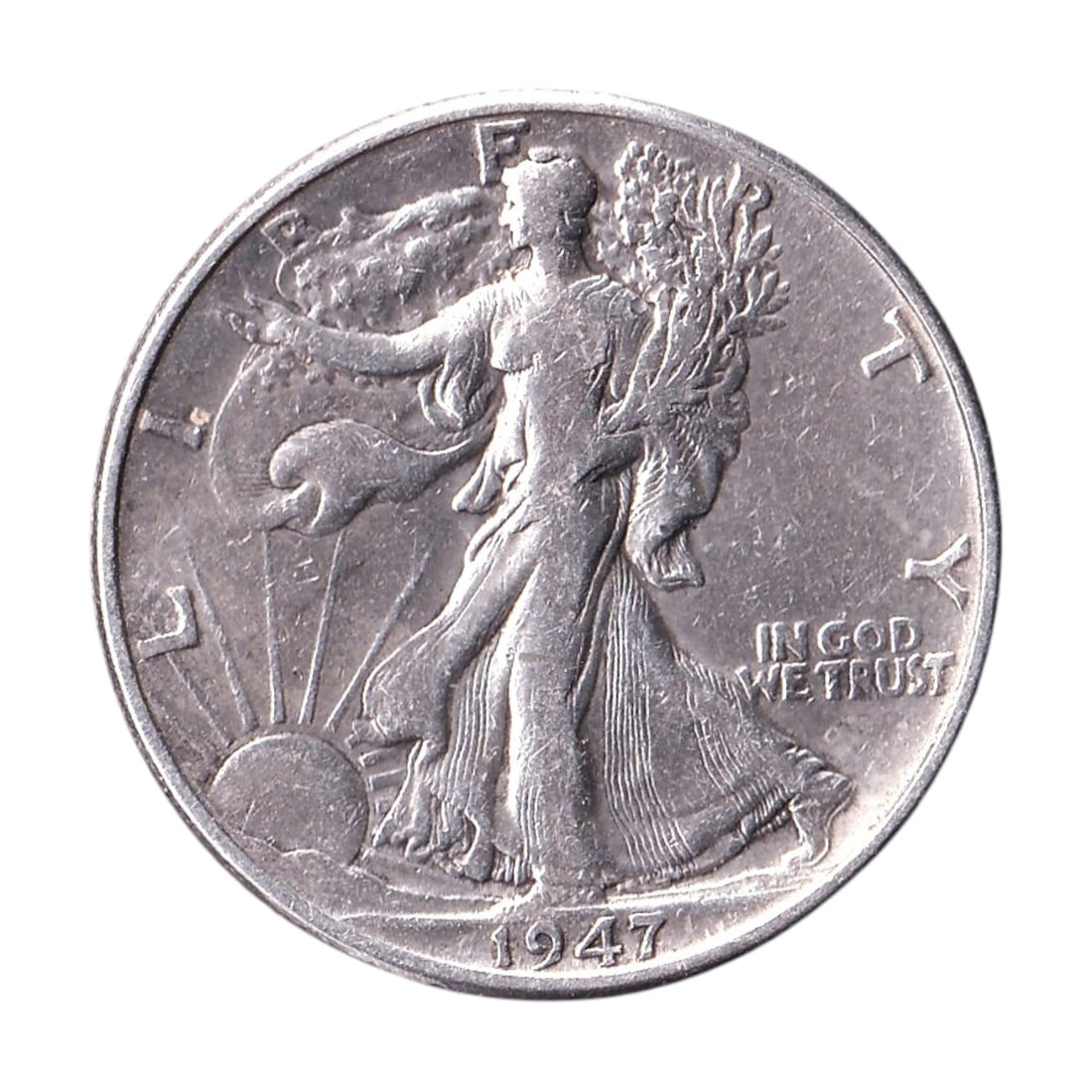 1947 USA Walking Liberty Half Dollar 90% Silver KM 142: 1947 United States Walking Liberty Half Dollar, a classic 50 cent silver coin from the final year of the celebrated Walking Liberty series. Struck in 90% silver and cataloged as KM 142, this historic 