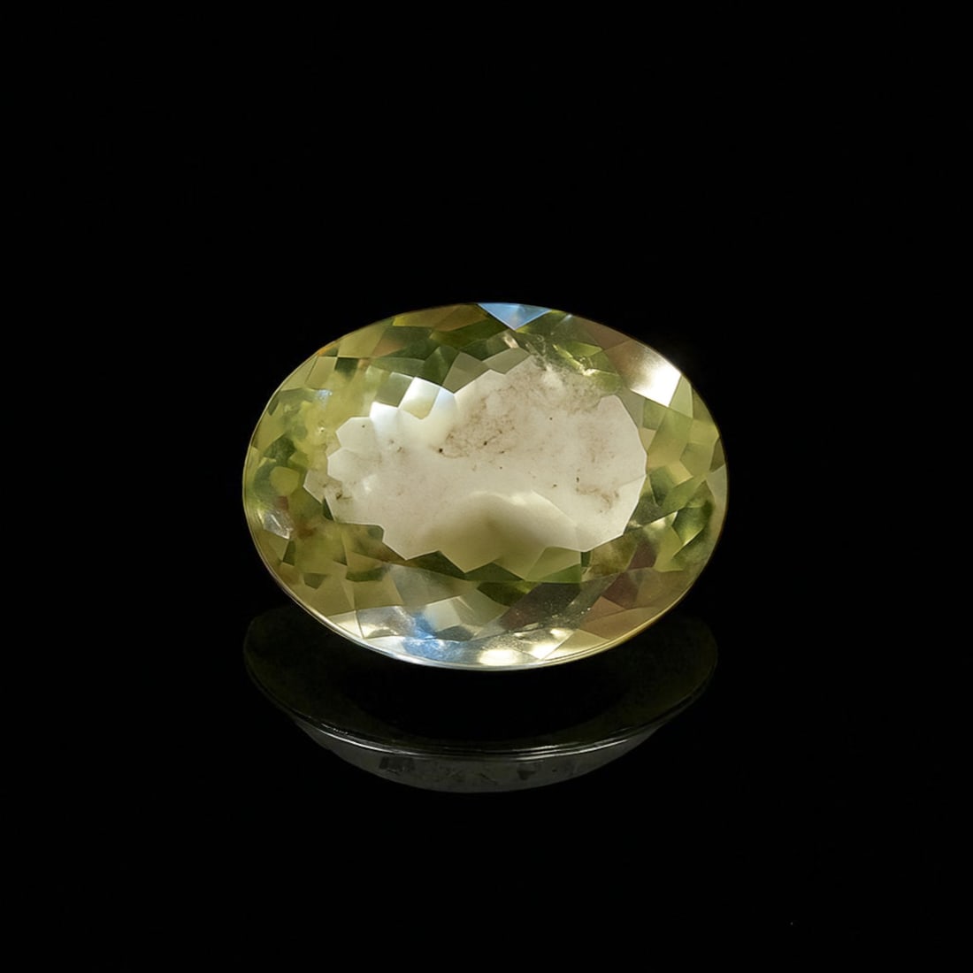 Natural Yellow Beryl, Oval Mixed Cut, 7.25 ct, IDT Certified: A natural yellow beryl weighing 7.25 carats, this transparent gemstone is presented in an oval mixed cut with bright, light-reflective facets. The stone measures 13.99 x 11.71 x 7.46 mm and displays a