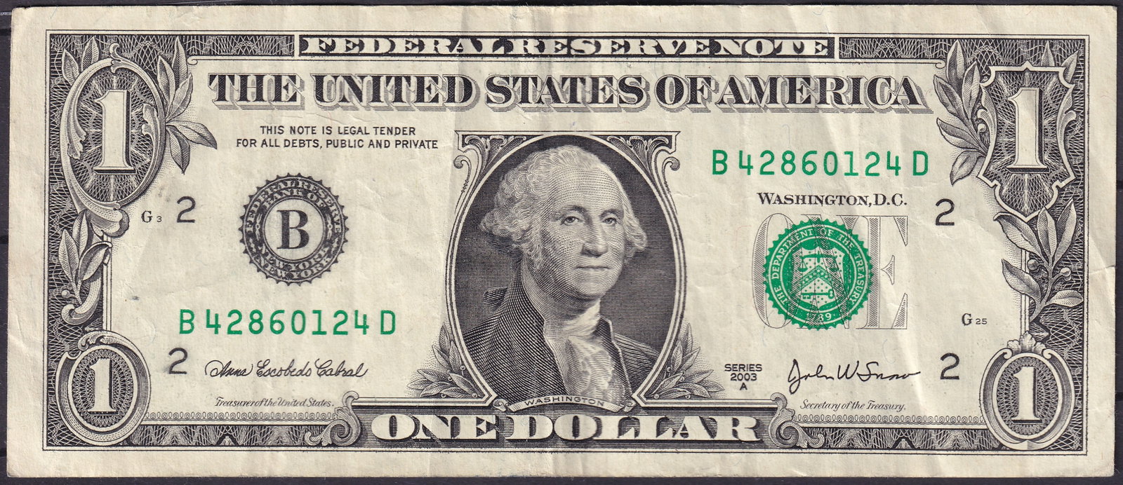 United States 2003 1 Federal Reserve Note, Serial B42860124D: Issued in 2003, this 1 Federal Reserve Note from the United States features the iconic portrait of George Washington, the nation’s first president, on the obverse, accompanied by the green Treasury 