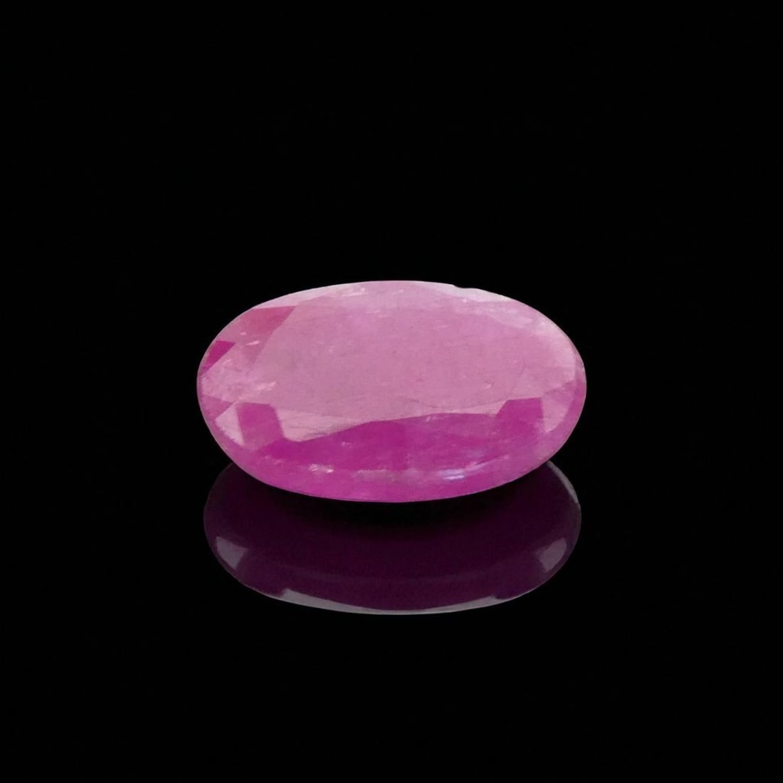 Natural Untreated 1.85 ct Purplish Red Ruby, Oval Mixed Cut, Afghanistan: A finely faceted natural ruby of exceptional character, this 1.85 carat gemstone exemplifies the unenhanced beauty and rarity of untreated corundum sourced from the storied gem-producing regions of Af