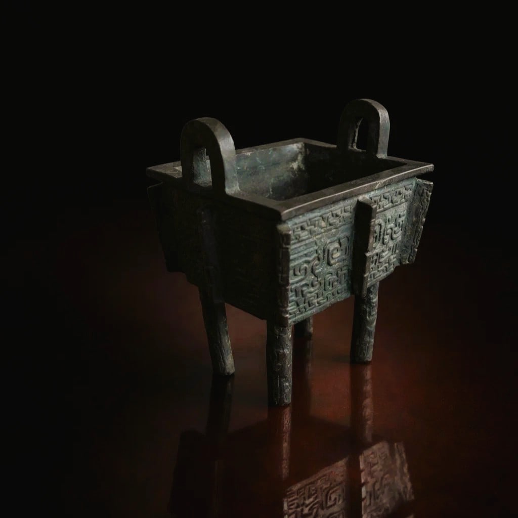 Qing Dynasty Ancient China Shang Bronze Fangding Ritual Incense Censer: This exceptional ritual bronze vessel is a finely cast fangding type incense censer originating from ancient China and stylistically attributable to the Shang Dynasty period circa 1600 to 1046 BC, one
