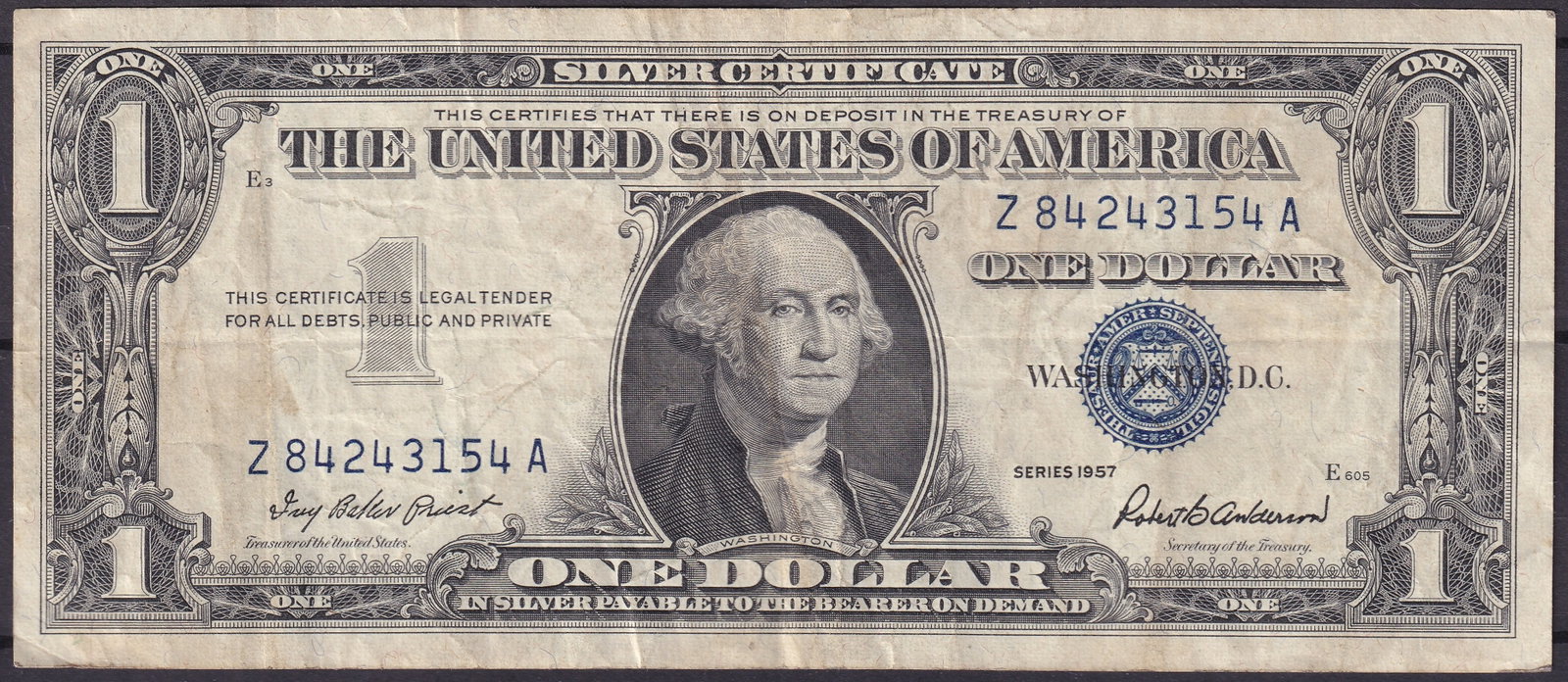 1957 USA 1 Silver Certificate Z84243154A – Blue Seal: This 1957 1 Silver Certificate of the United States, bearing the serial number Z84243154A, represents one of the final issues of silver-backed notes before the Treasury ceased their redemption in the 