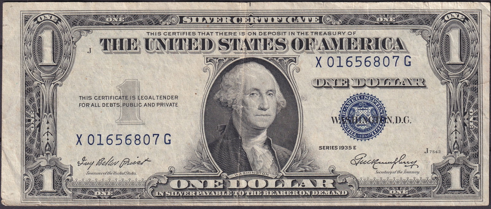 USA 1935E Silver Certificate 1 George Washington, Serial X01656807G: Issued in 1935, this United States 1 Silver Certificate (Series 1935E) bears the portrait of George Washington at center, engraved in deep black and framed by an ornate design. The blue Treasury seal 