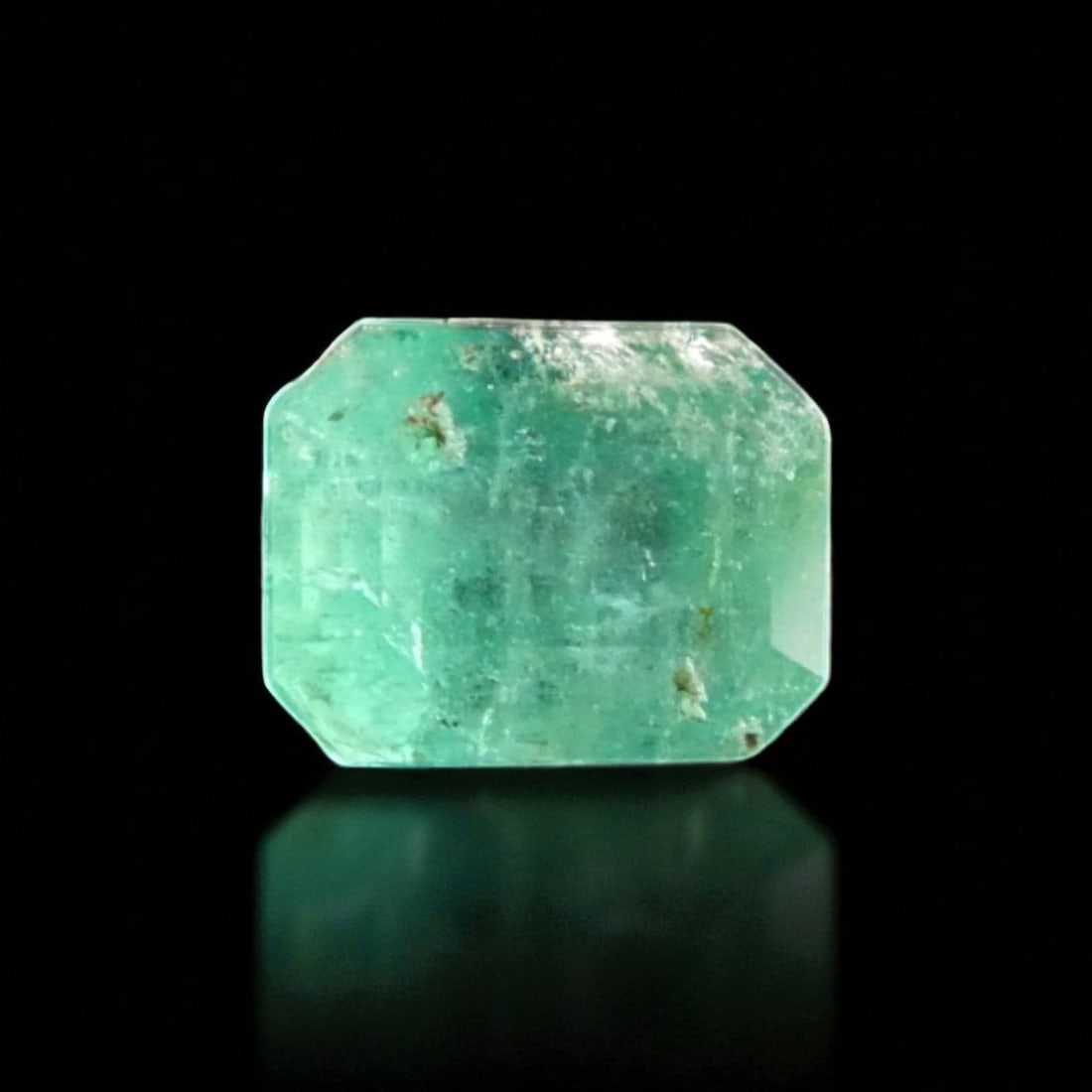 Emerald 2023 IGI Certified 1.24 Carat Blush Green Emerald Cut Natural Beryl: This certified natural emerald, graded by IGI in 2023 under report number 579354905, is a 1.24 carat blush green gemstone fashioned in a classic emerald cut, showing a balanced outline with defined st