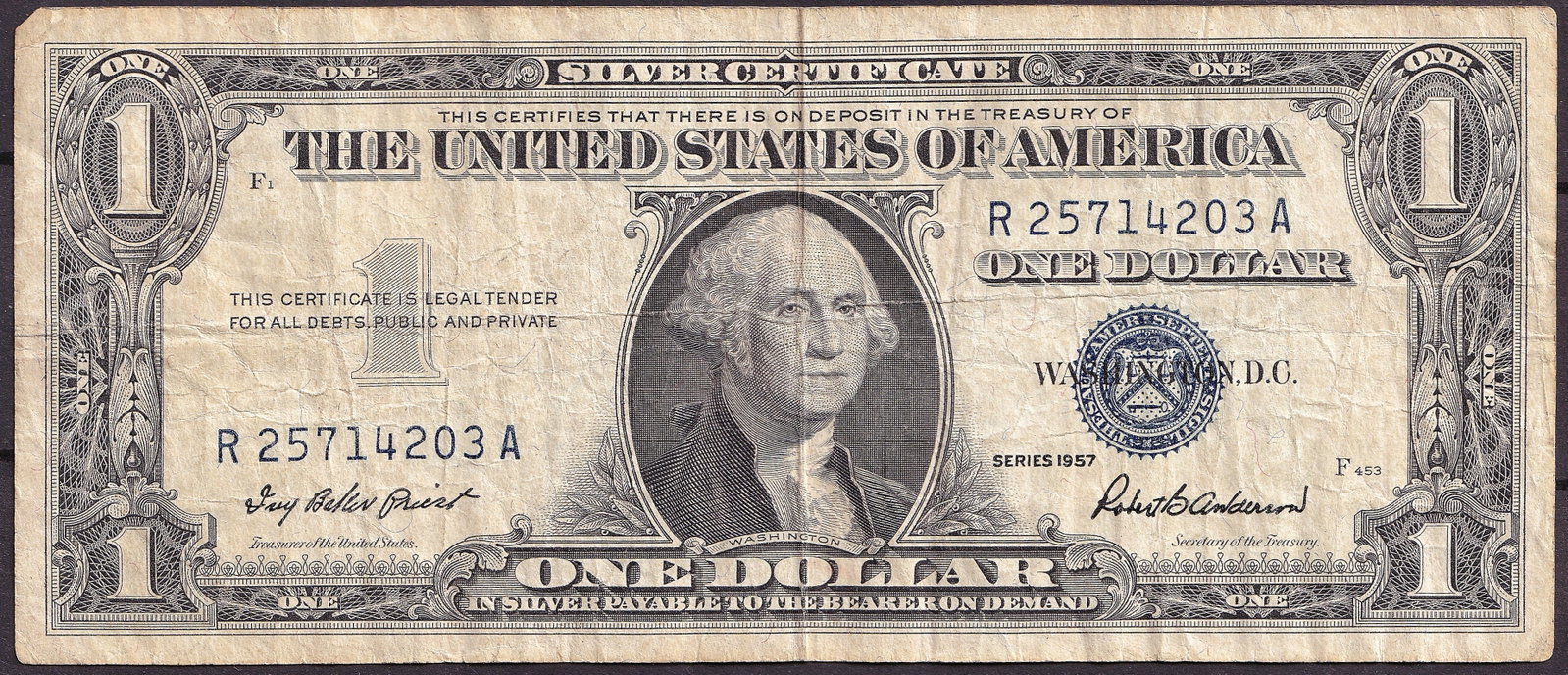 1957 United States Silver Certificate One Dollar R25714203A: United States Silver Certificate banknote issued in the Series of 1957 featuring the portrait of George Washington and bearing serial number R25714203A. Silver Certificates were a distinctive form of 