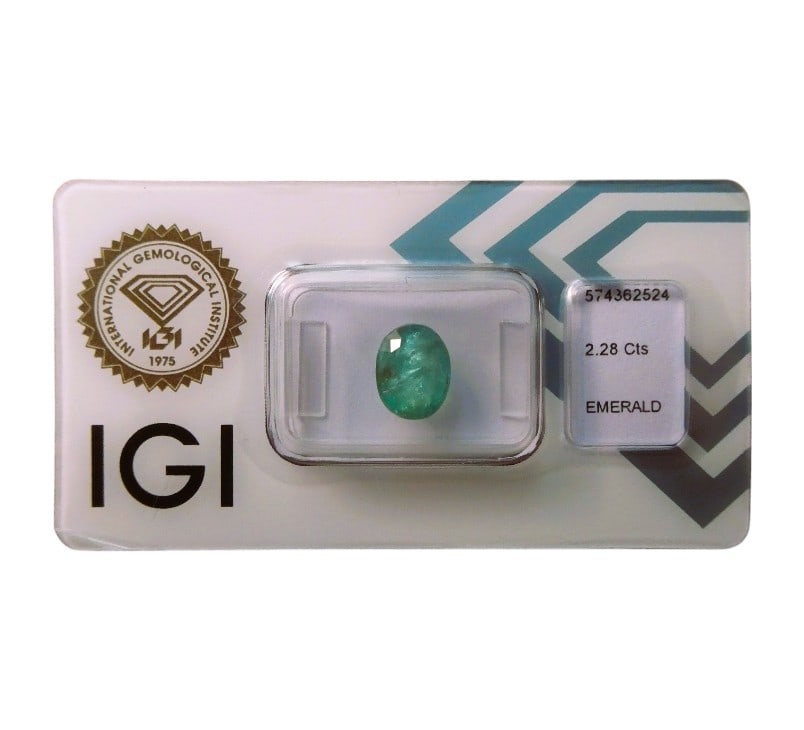 IGI Certified 2.28 ct Zambian Emerald, Oval Mixed Cut: This certified natural emerald weighs 2.28 carats and has been evaluated by the International Gemological Institute (IGI) under report number 574362524, dated May 8, 2023. The gemstone is classified a